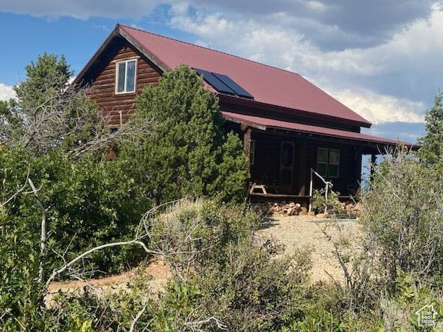 View of side of property with solar panels