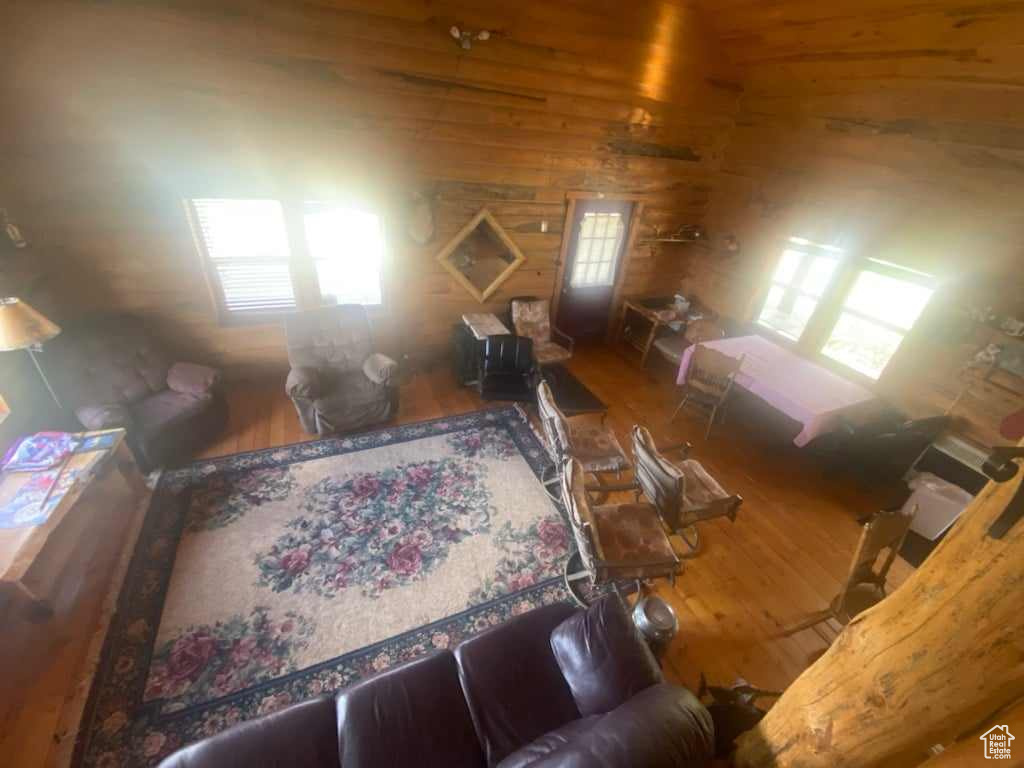 Living room with hardwood / wood-style flooring