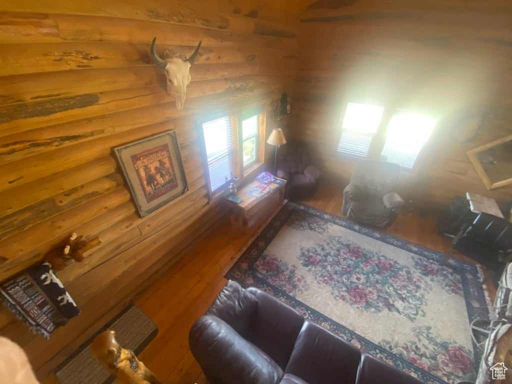 Living room with hardwood / wood-style flooring