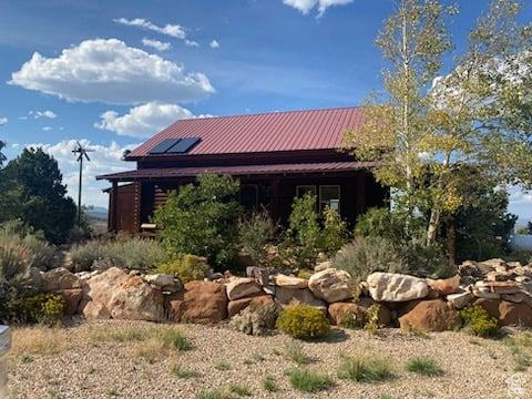 View of side of property with solar panels