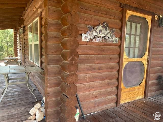 Entrance to property featuring a porch