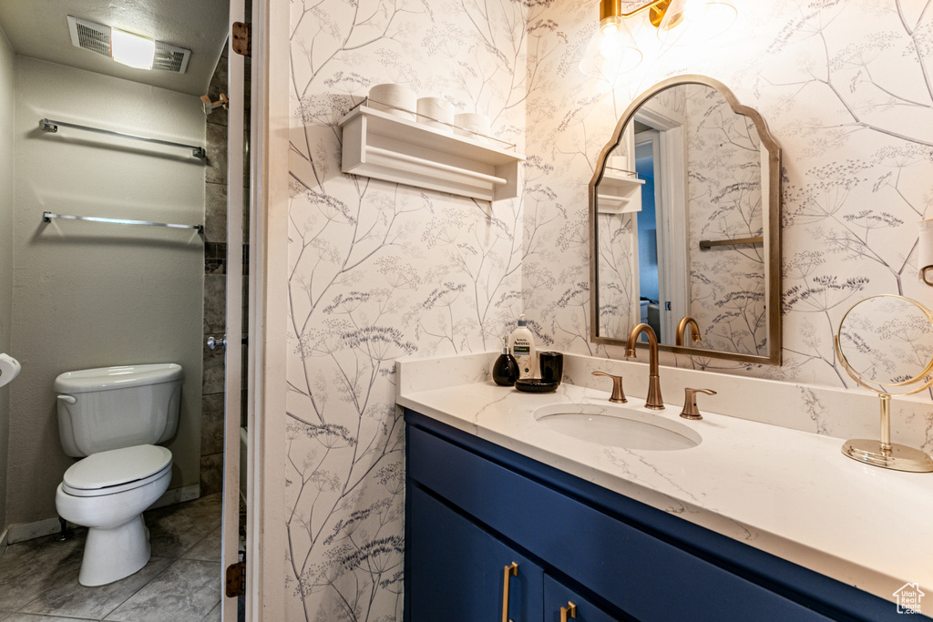 Bathroom featuring vanity and toilet