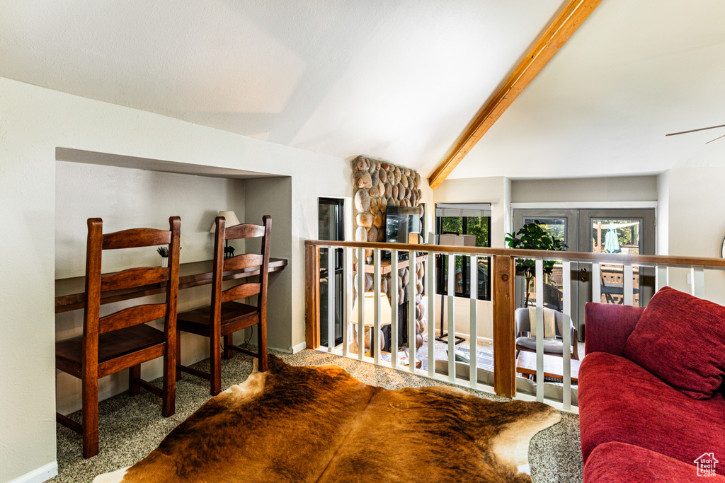 Interior space with french doors, vaulted ceiling, and carpet floors