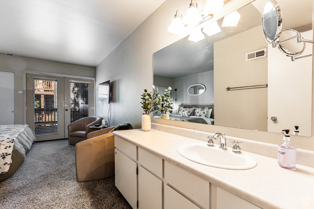 Bathroom featuring a skylight and vanity