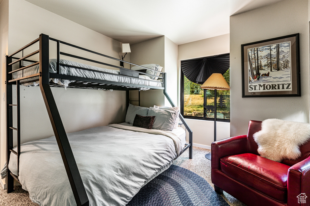 Bedroom with light colored carpet