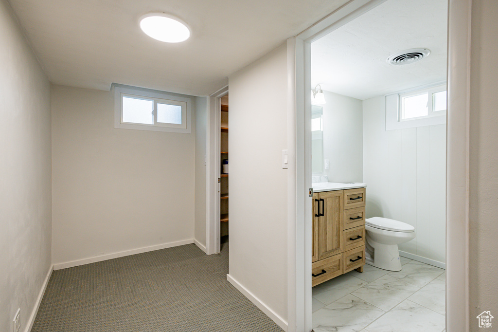 Bathroom featuring vanity and toilet