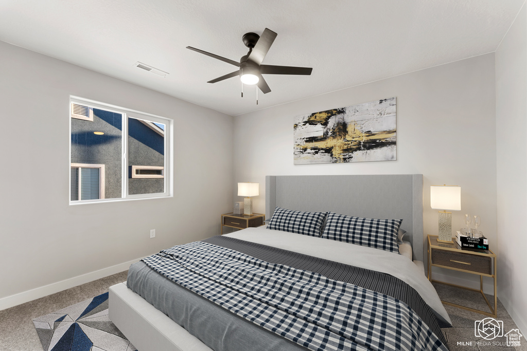 Carpeted bedroom with ceiling fan