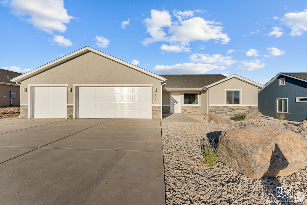 Single story home featuring a garage