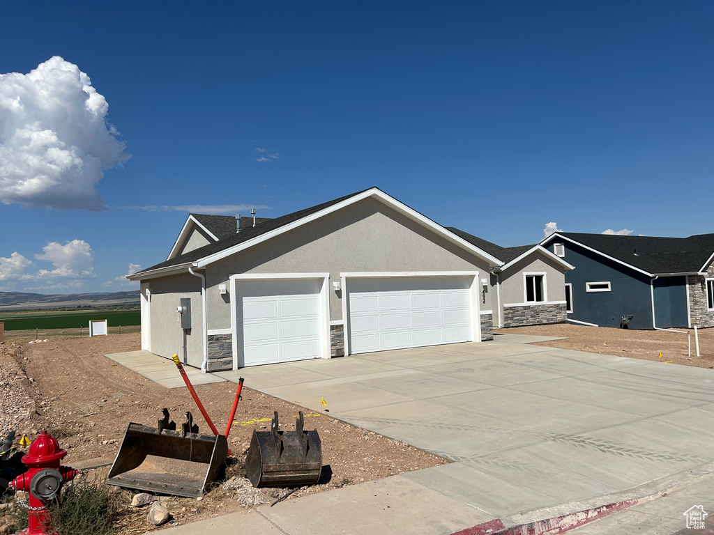 View of front of home featuring a garage