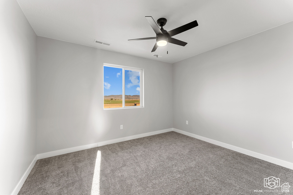 Unfurnished room with carpet floors and ceiling fan