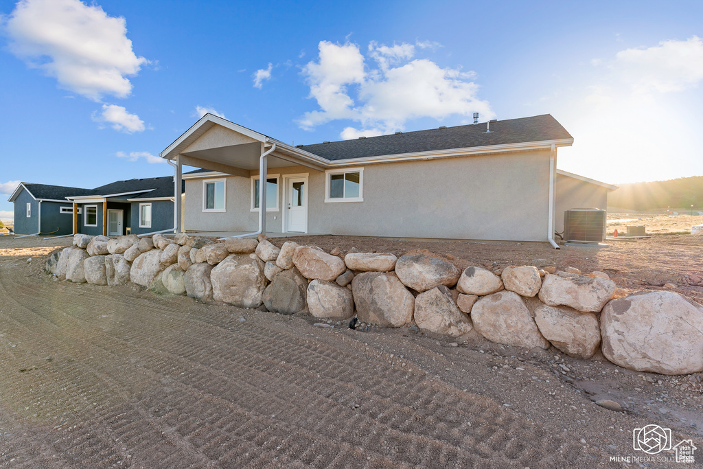 Single story home with central air condition unit