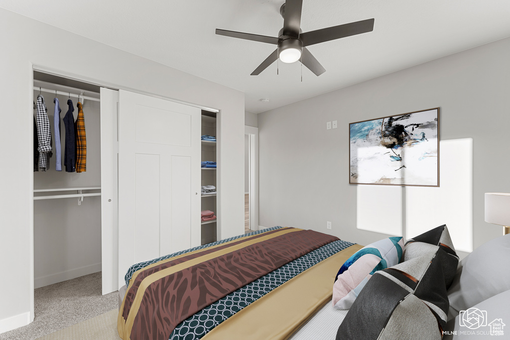 Bedroom featuring ceiling fan, a closet, and light carpet