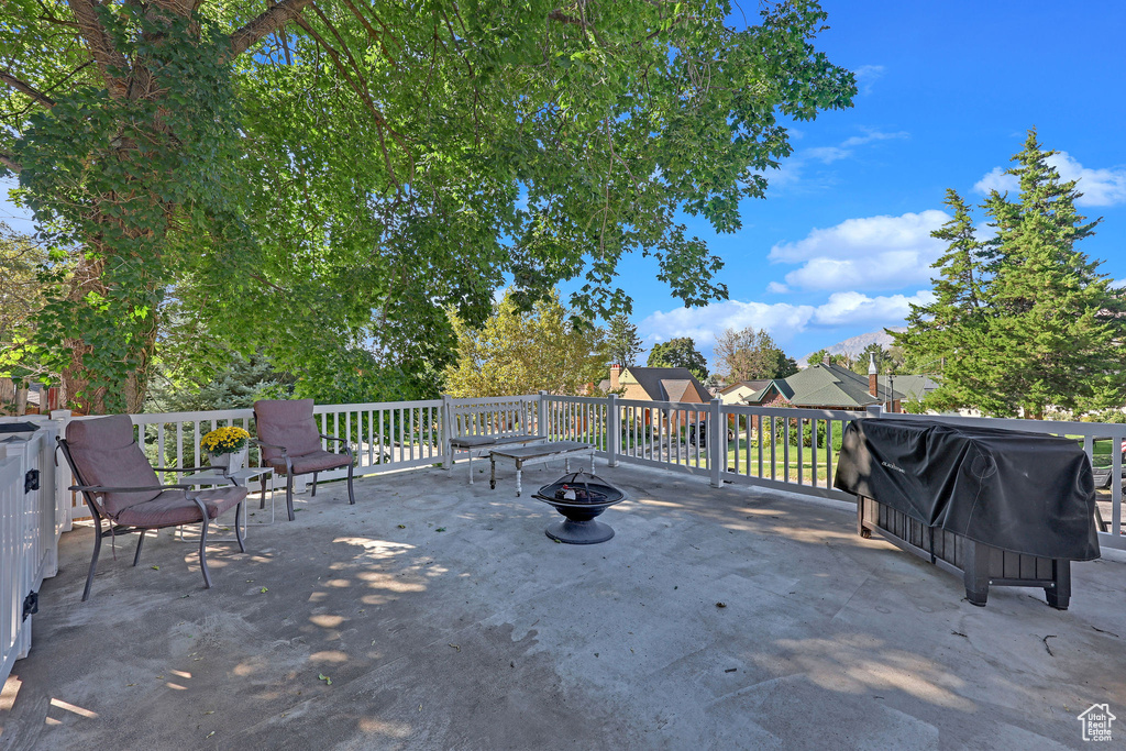 View of patio featuring a fire pit