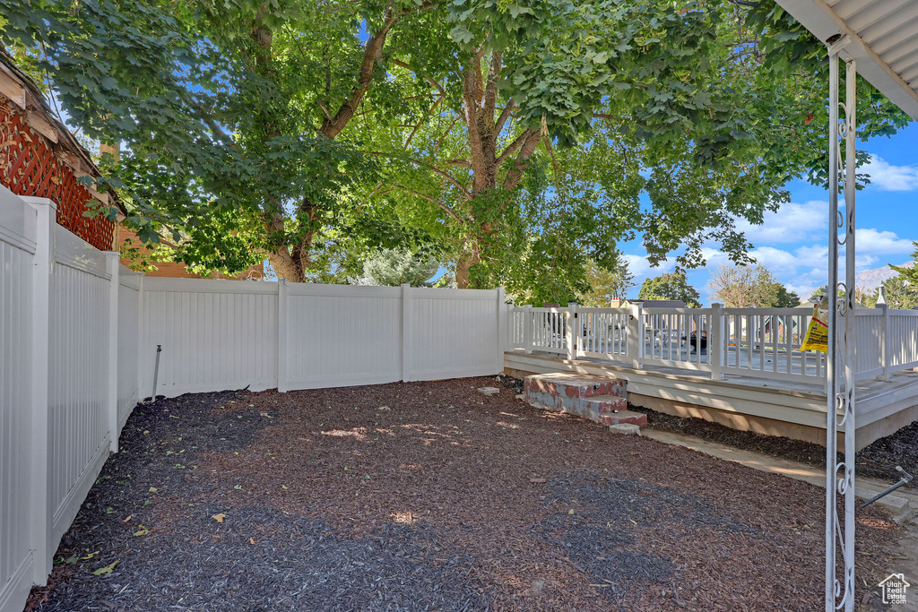 View of yard with a deck