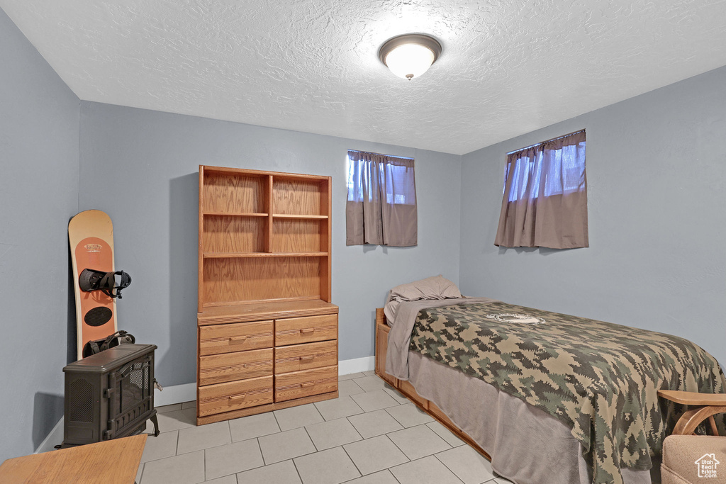 Bedroom with a textured ceiling