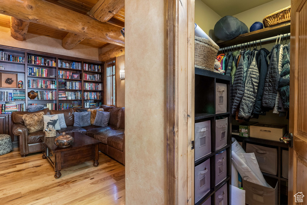 Sitting room featuring hardwood / wood-style floors and beam ceiling