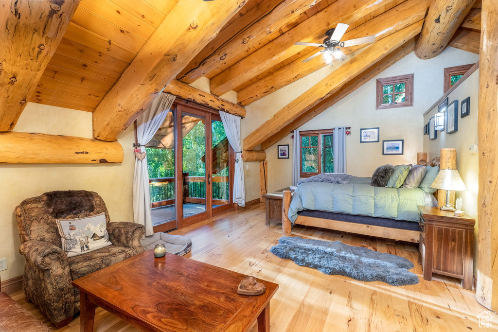 Bedroom with hardwood / wood-style floors, ceiling fan, lofted ceiling with beams, and access to outside
