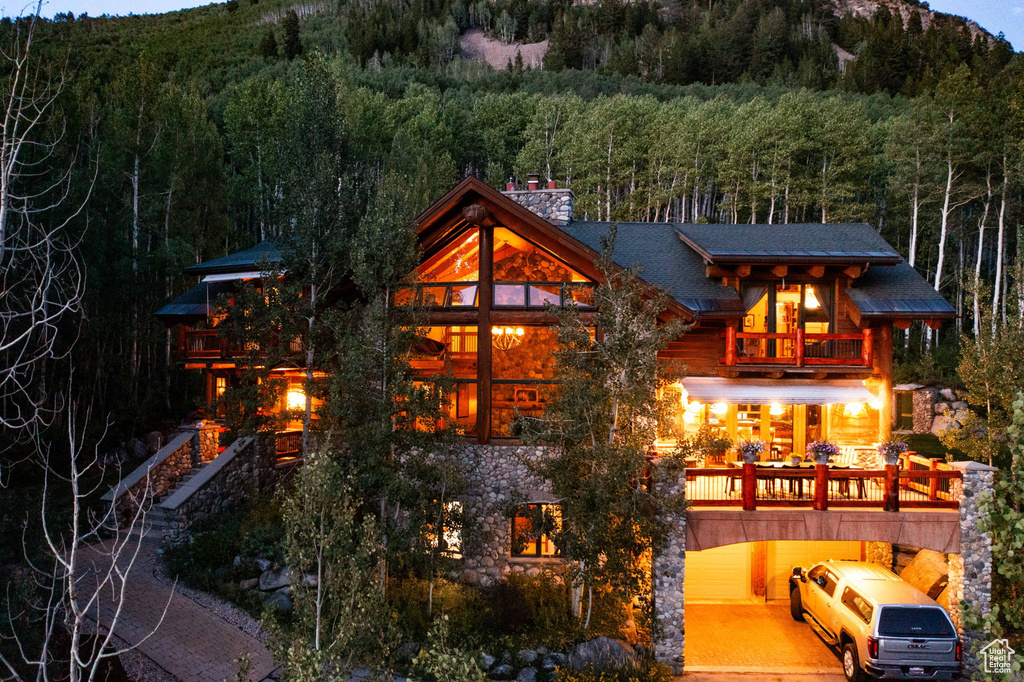 Back of property featuring a mountain view
