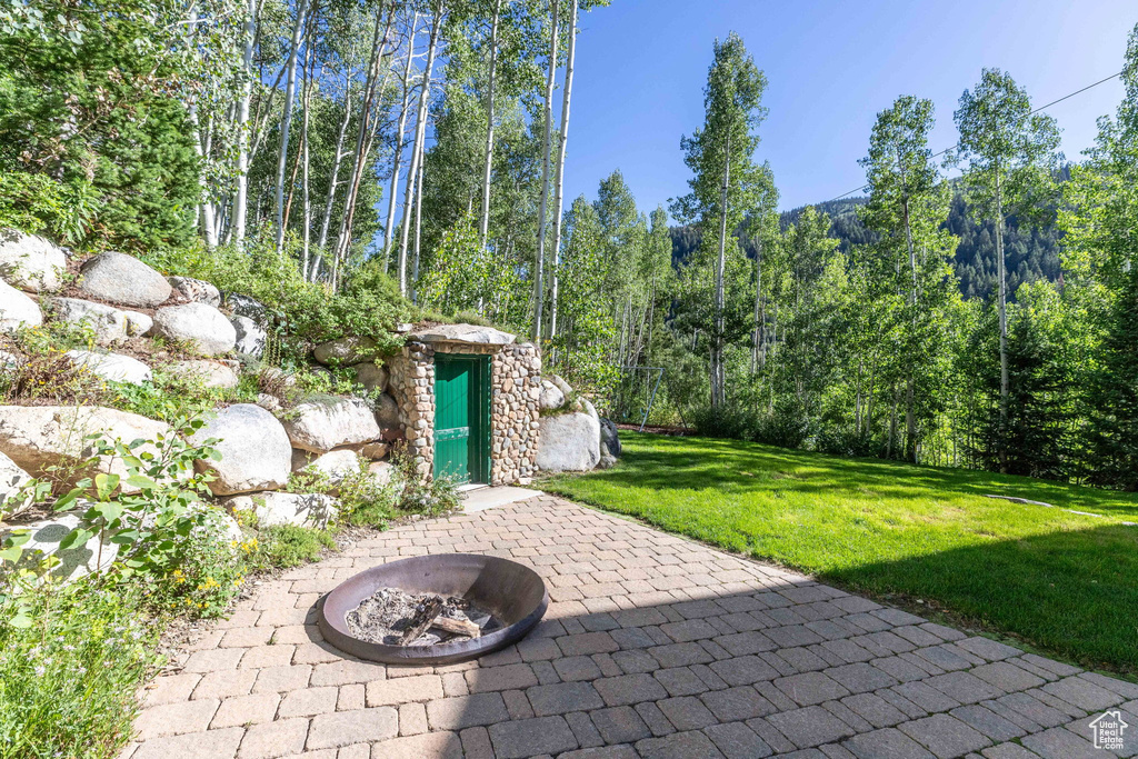 View of patio featuring a fire pit
