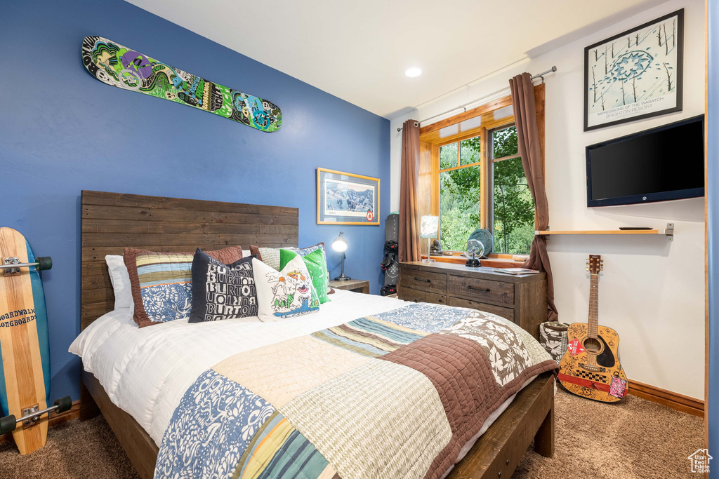 Bedroom with dark carpet