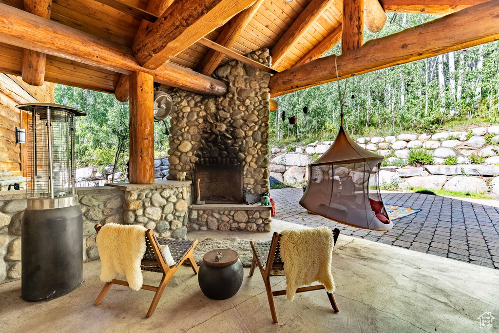 View of patio / terrace with an outdoor stone fireplace