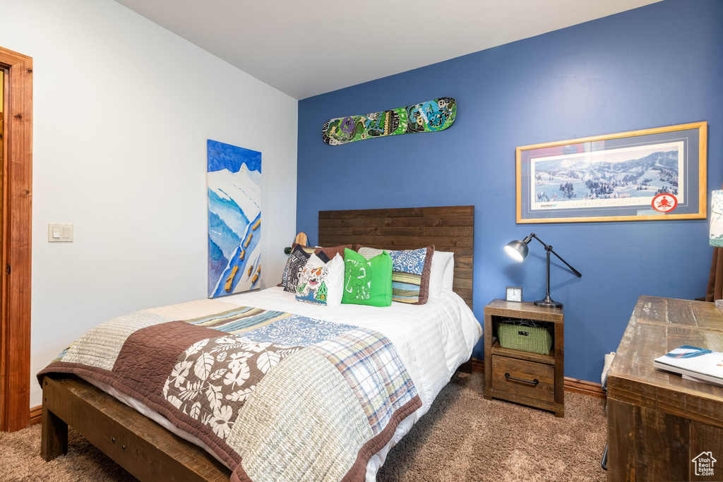 Bedroom featuring carpet floors