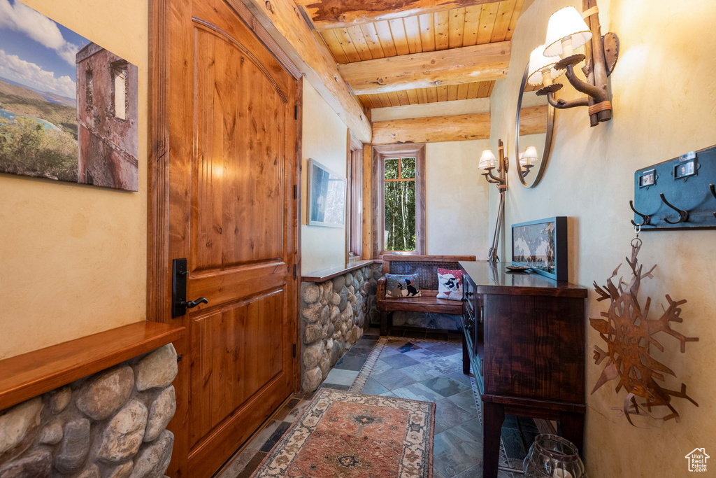 Interior space with wood ceiling and beamed ceiling