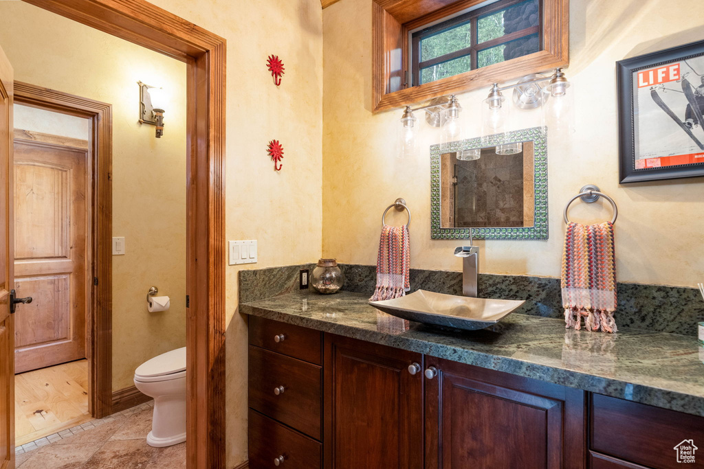Bathroom featuring vanity and toilet