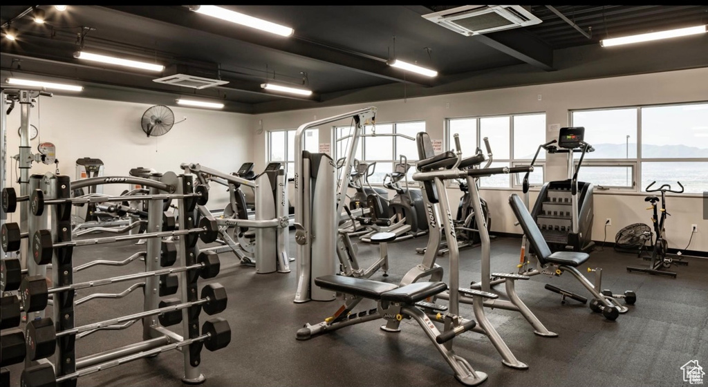 Gym featuring a water view