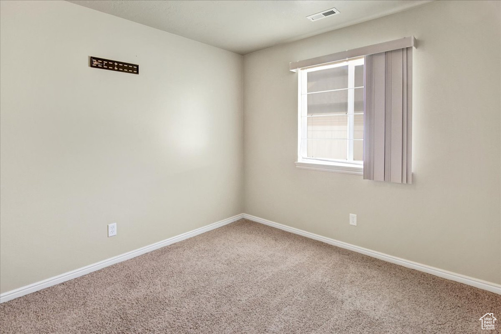 View of carpeted spare room