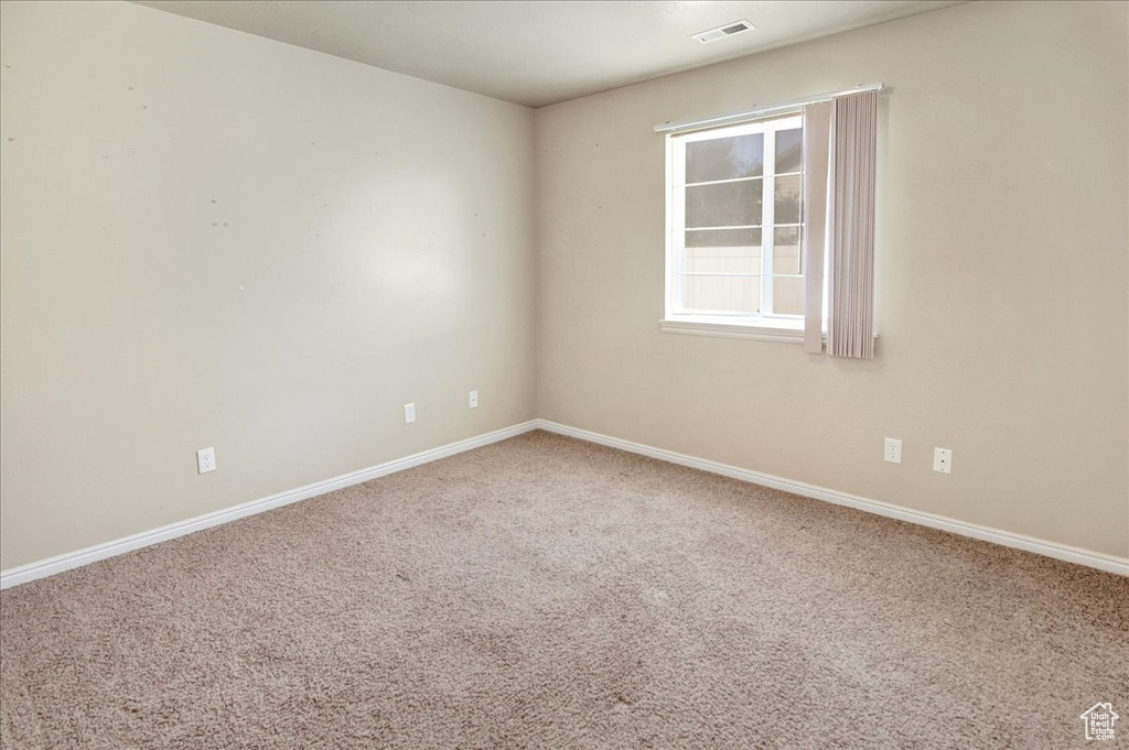 Unfurnished room with carpet floors