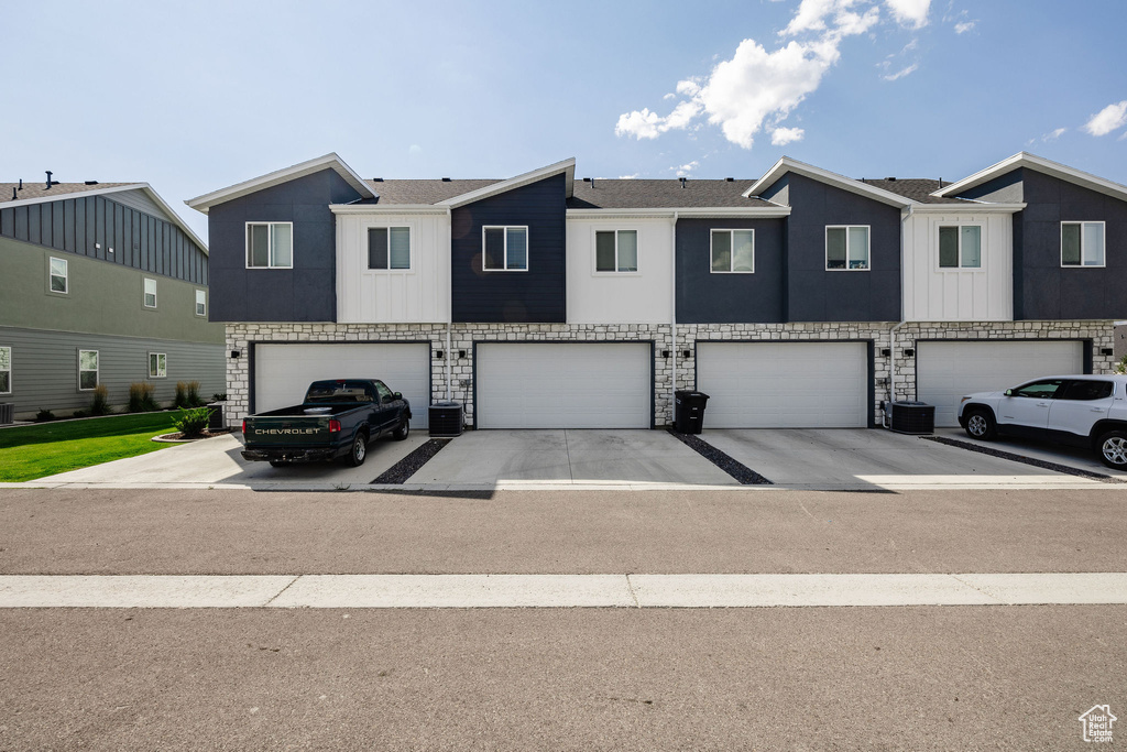 View of property with a garage