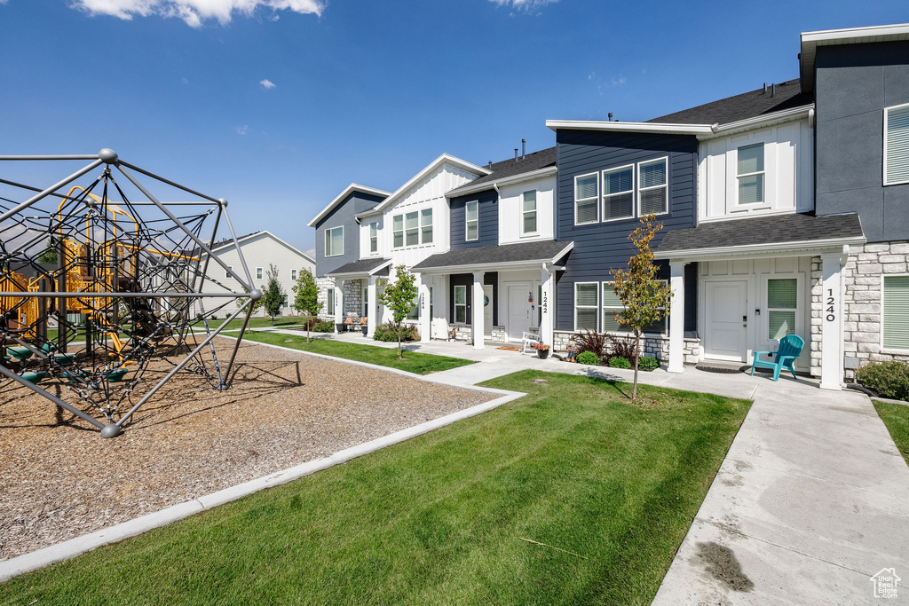 View of front of property featuring a front yard and a porch