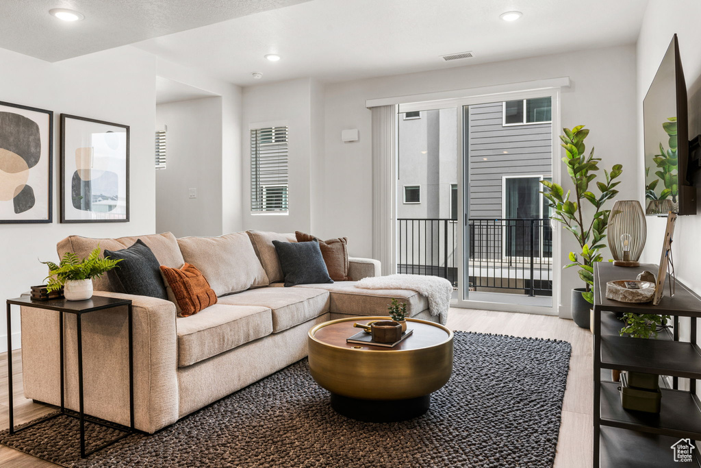 Living room with light hardwood / wood-style flooring