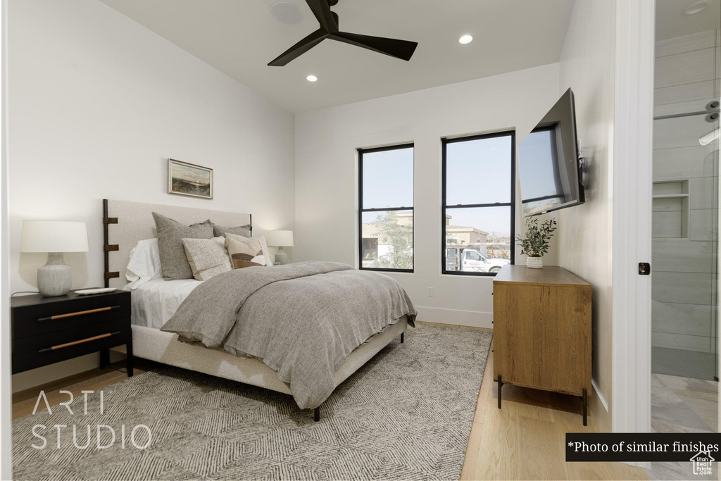 Bedroom featuring ceiling fan and light hardwood / wood-style floors