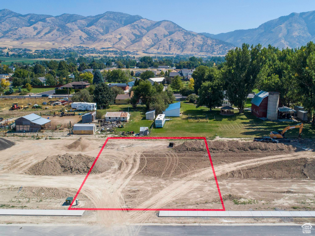 Birds eye view of property with a mountain view