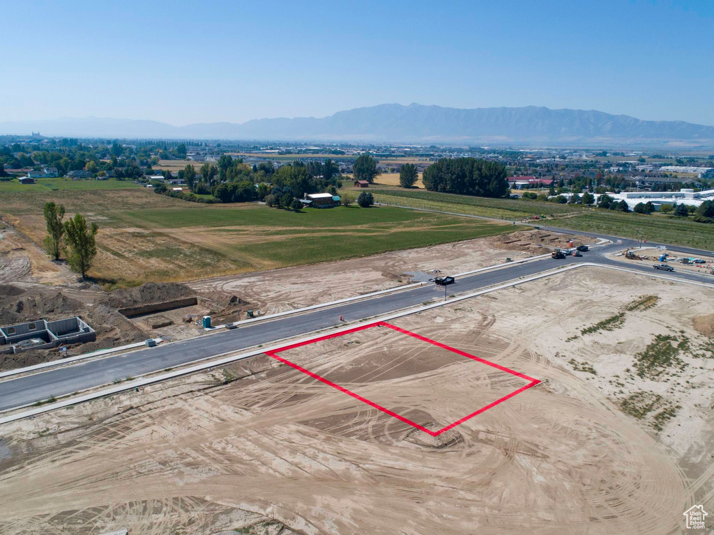 Birds eye view of property with a mountain view