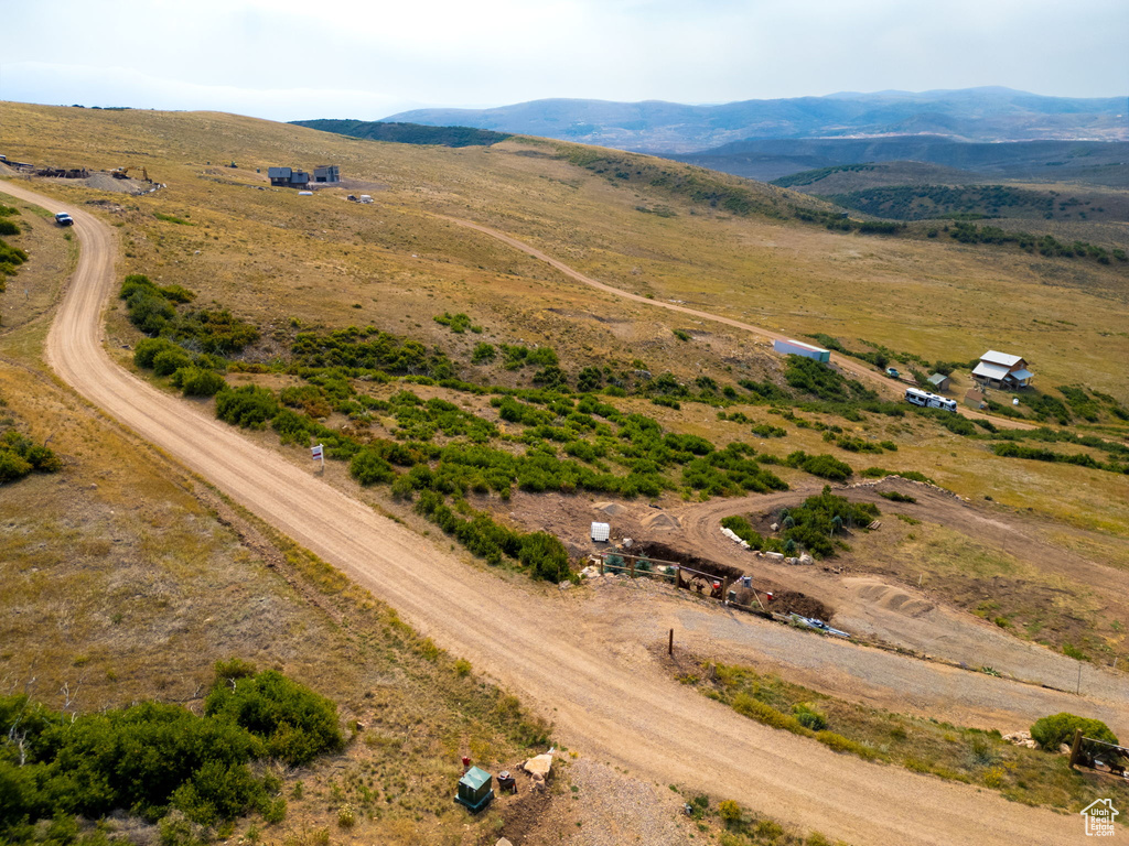 Birds eye view of property featuring a mountain view and a rural view