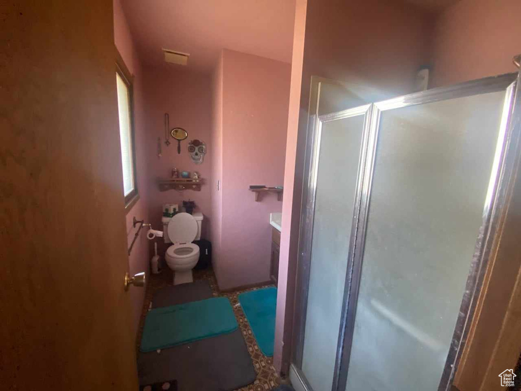 Bathroom with toilet and walk in shower