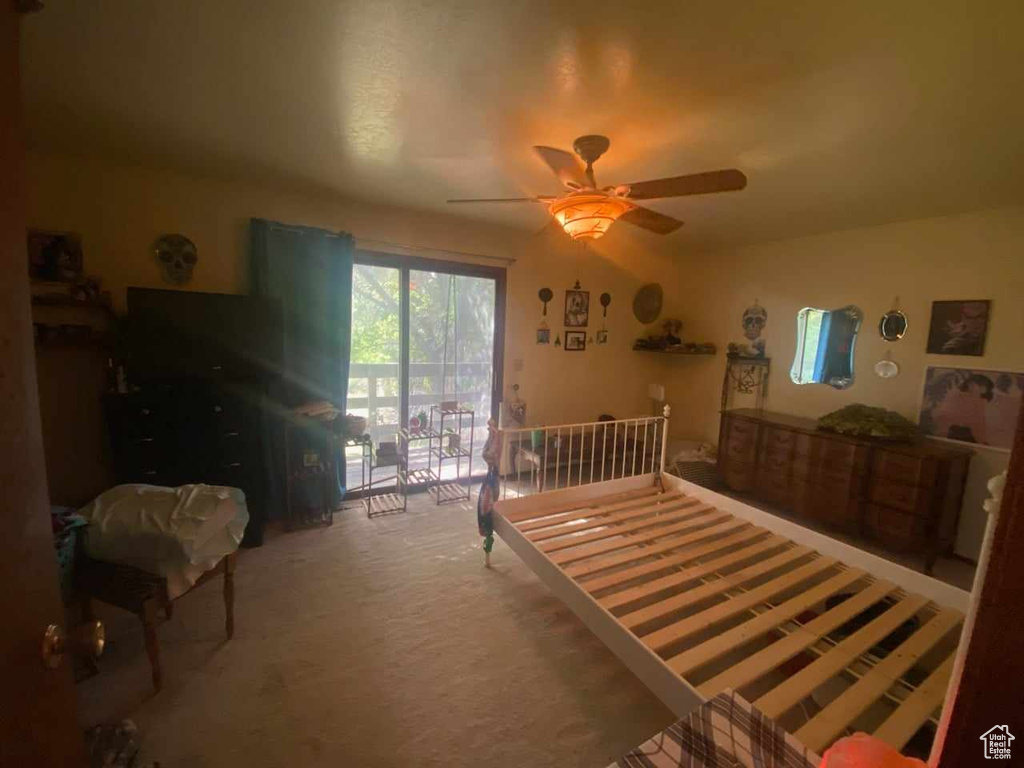 Carpeted bedroom featuring access to outside