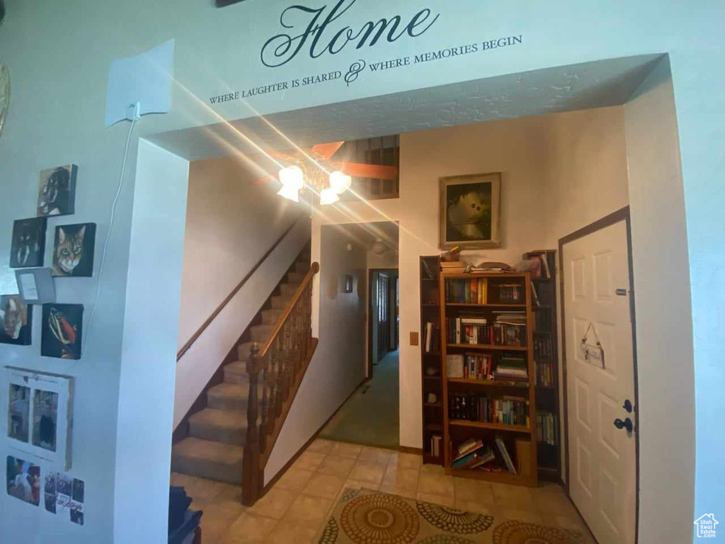 Hallway featuring tile patterned flooring