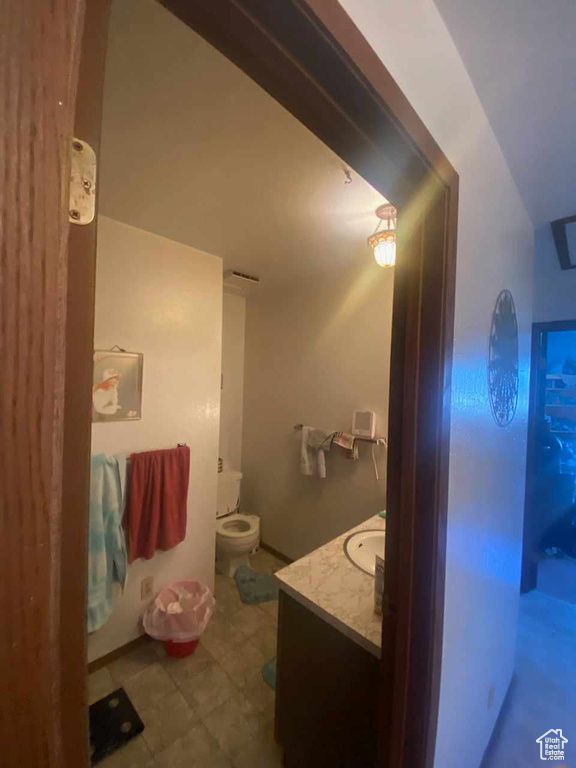 Bathroom featuring vanity and toilet