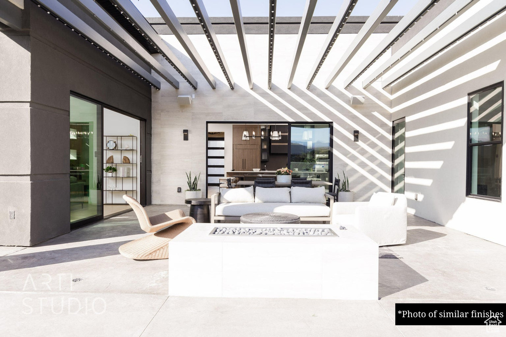 View of patio / terrace with an outdoor living space and a pergola