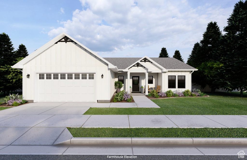 Modern inspired farmhouse with a garage and a front yard