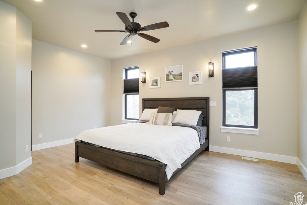 Bedroom featuring light wood-type flooring and ceiling fan