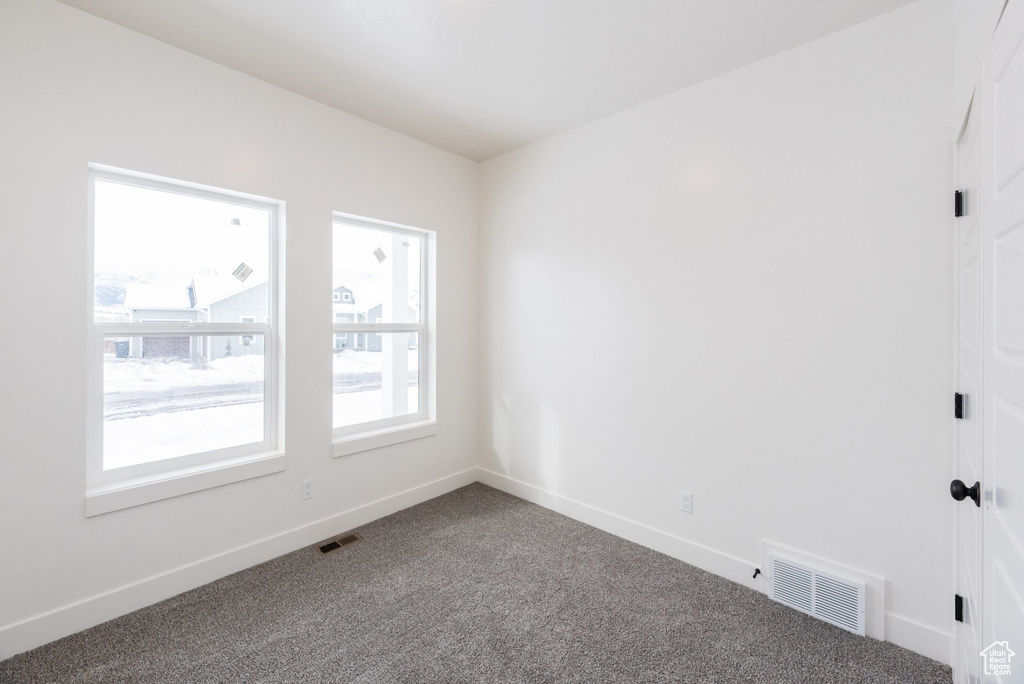 View of carpeted spare room