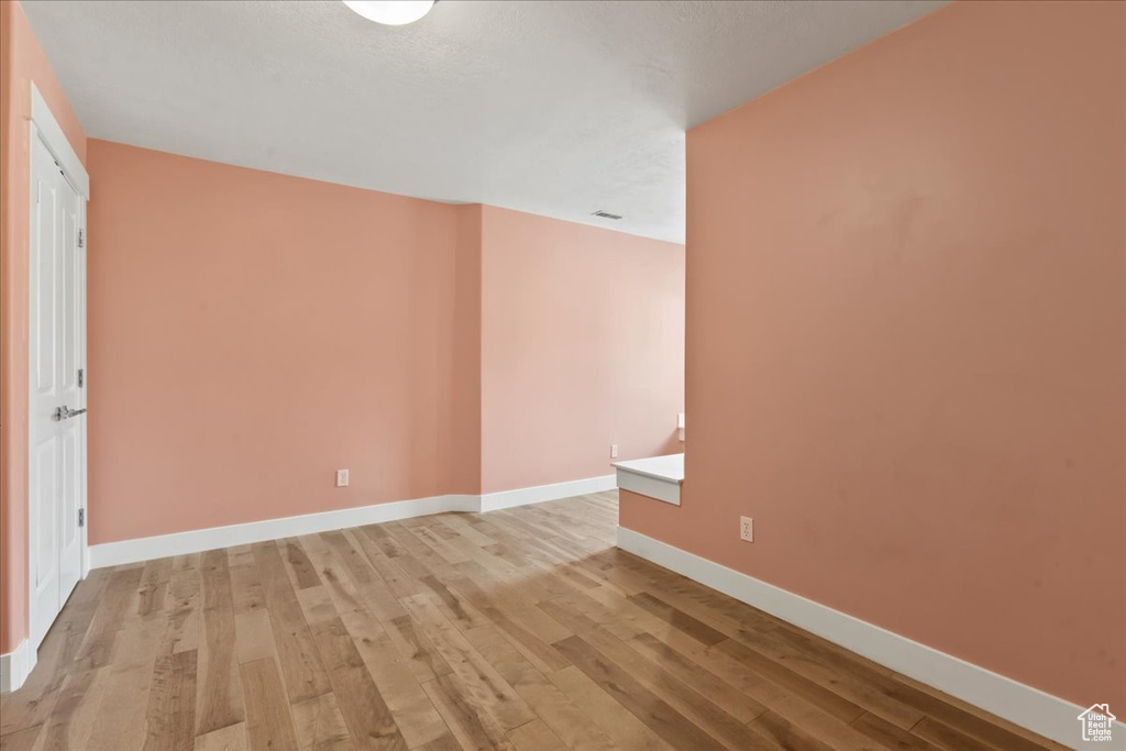 Spare room with light hardwood / wood-style flooring