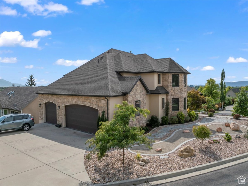 View of front of home featuring a garage