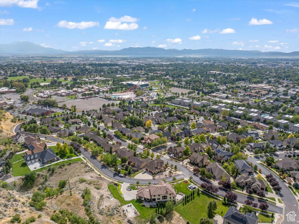 Birds eye view of property with a mountain view