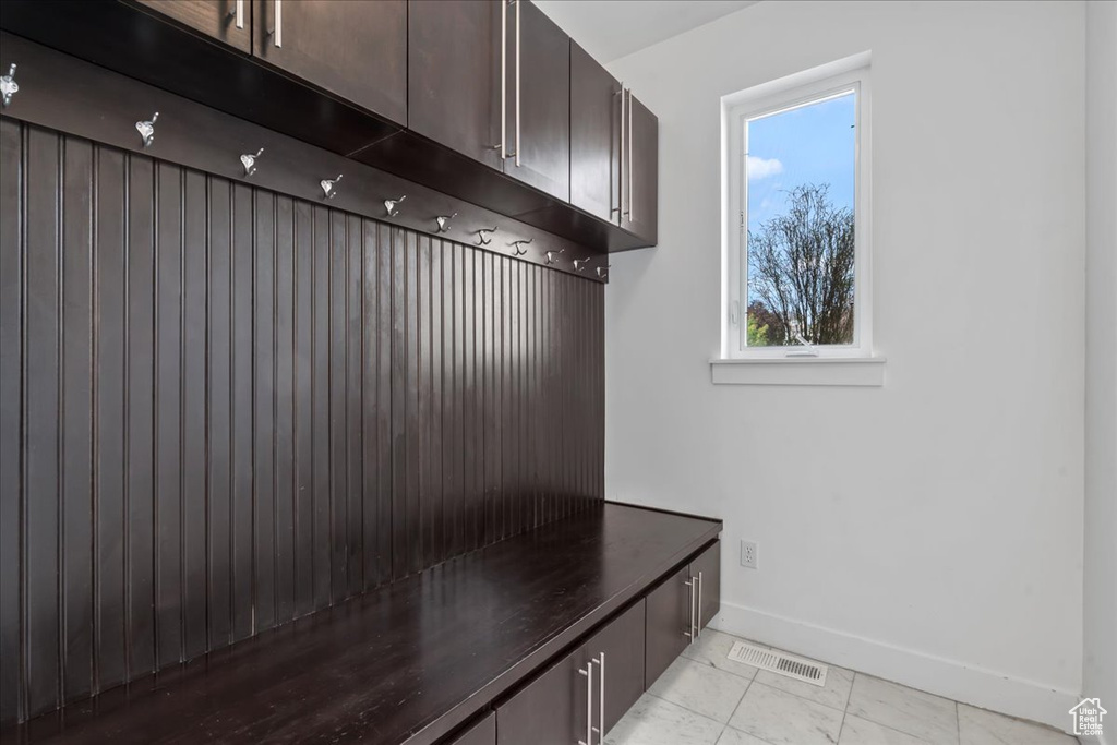 Mudroom featuring light tile patterned flooring